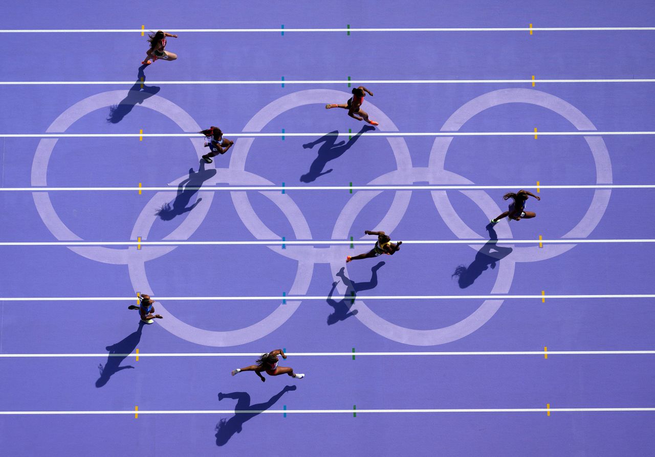 Athletes compete in a women's 200-meter heat on August 4. 