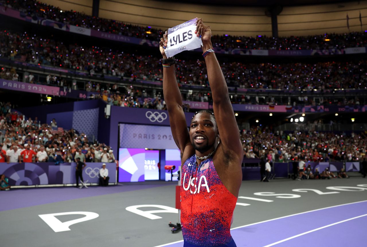 Lyles celebrates winning the gold medal.