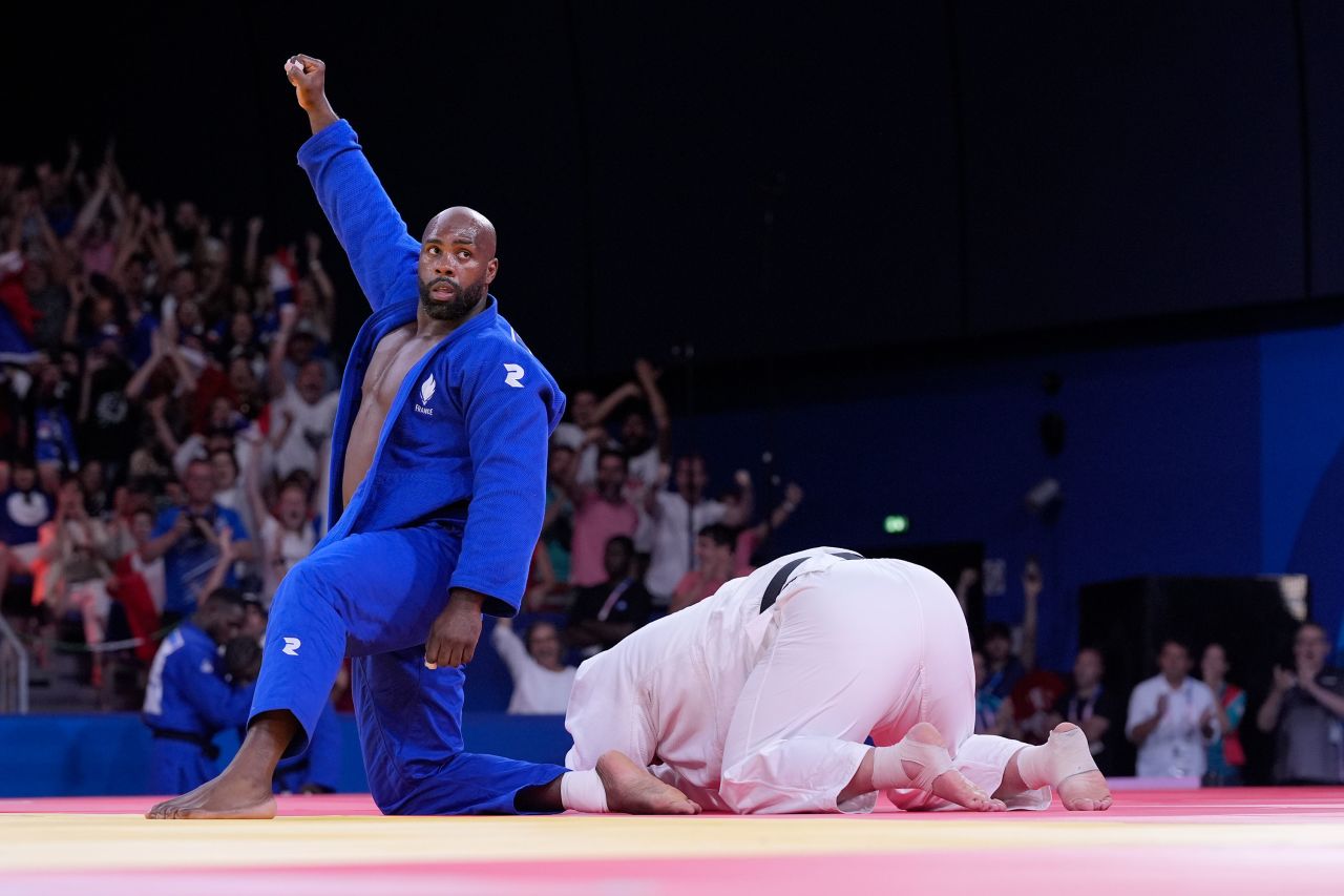 France's Teddy Riner celebrates after defeating Japan's Tatsuru Saito. 