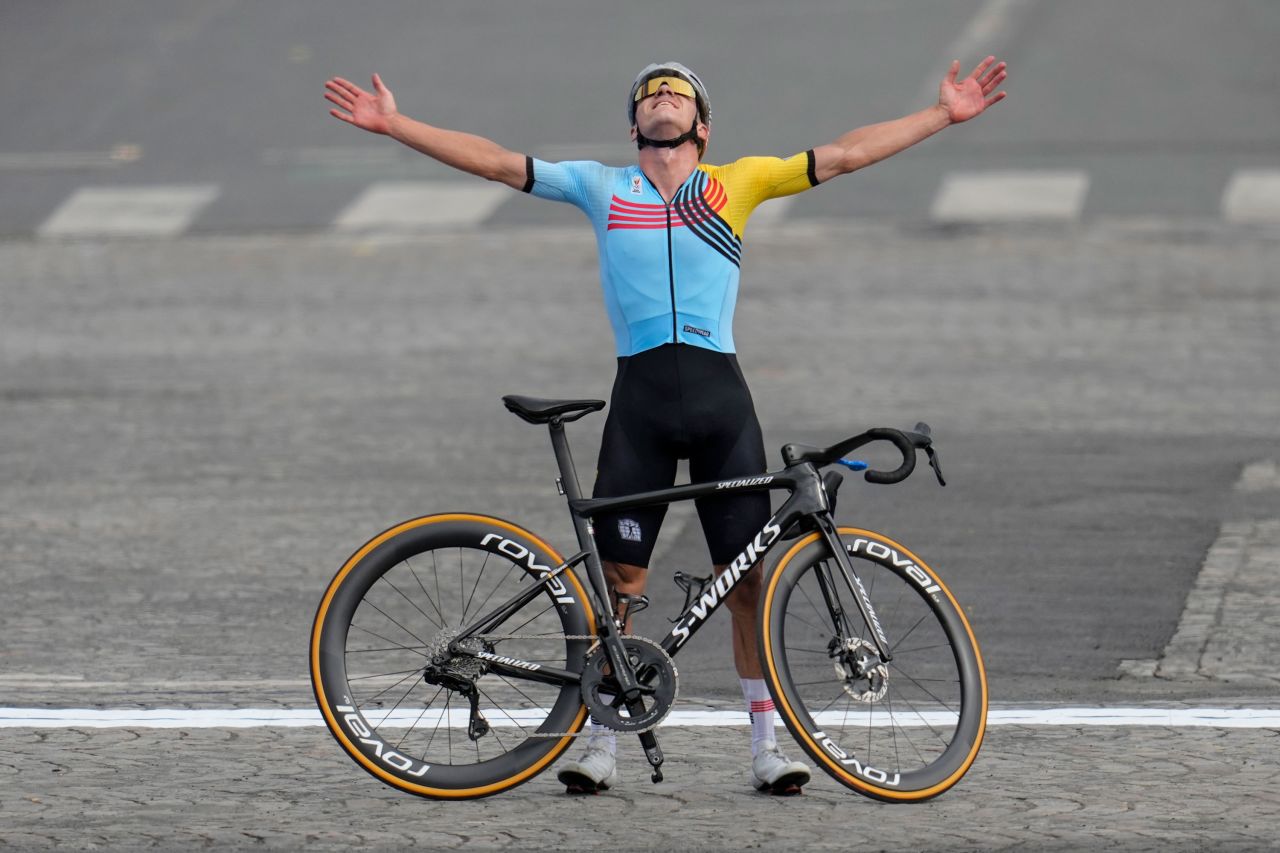 Evenepoel poses with his bike after winning the gold medal. 