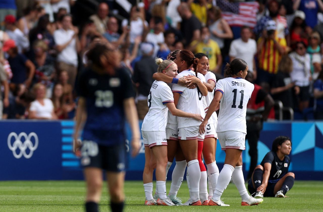 USA players celebrate after winning the match against Japan on August 3. 