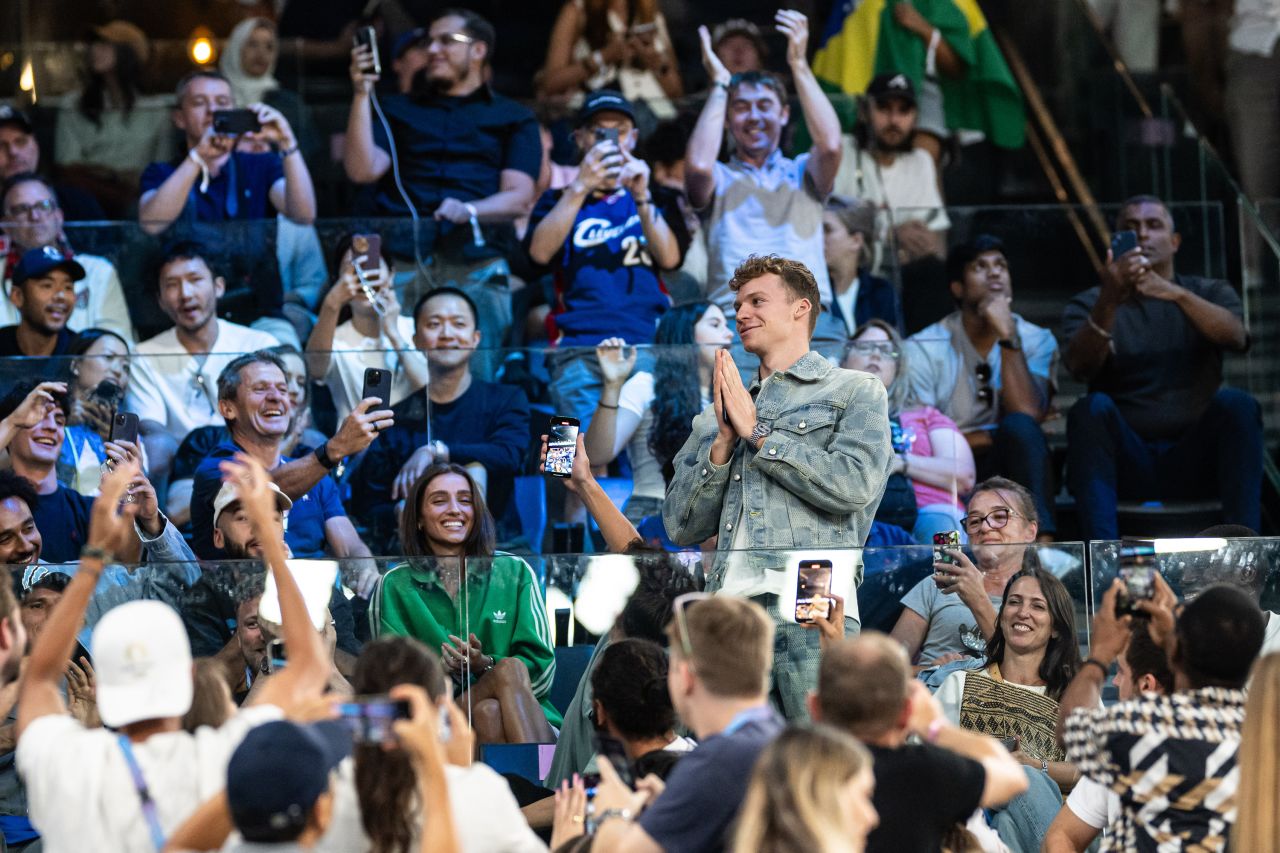 Léon Marchand of France is celebrated by fans during the quarterfinal basketball match between USA and Brazil, in Paris, on August 6.