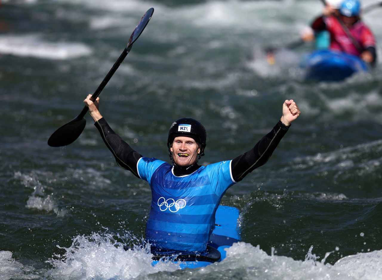 Finn Butcher of Team New Zealand celebrates after winning gold in the canoe slalom men's kayak cross final on day ten of the Olympic Games Paris 2024.