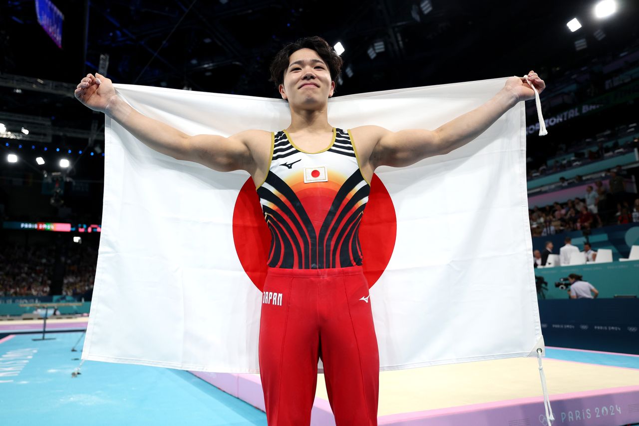 Shinnosuke Oka of Team Japan celebrates winning the gold medal after competing in the artistic gymnastics men's horizontal bar final on day ten of the Olympic Games Paris 2024 at Bercy Arena on August 5.