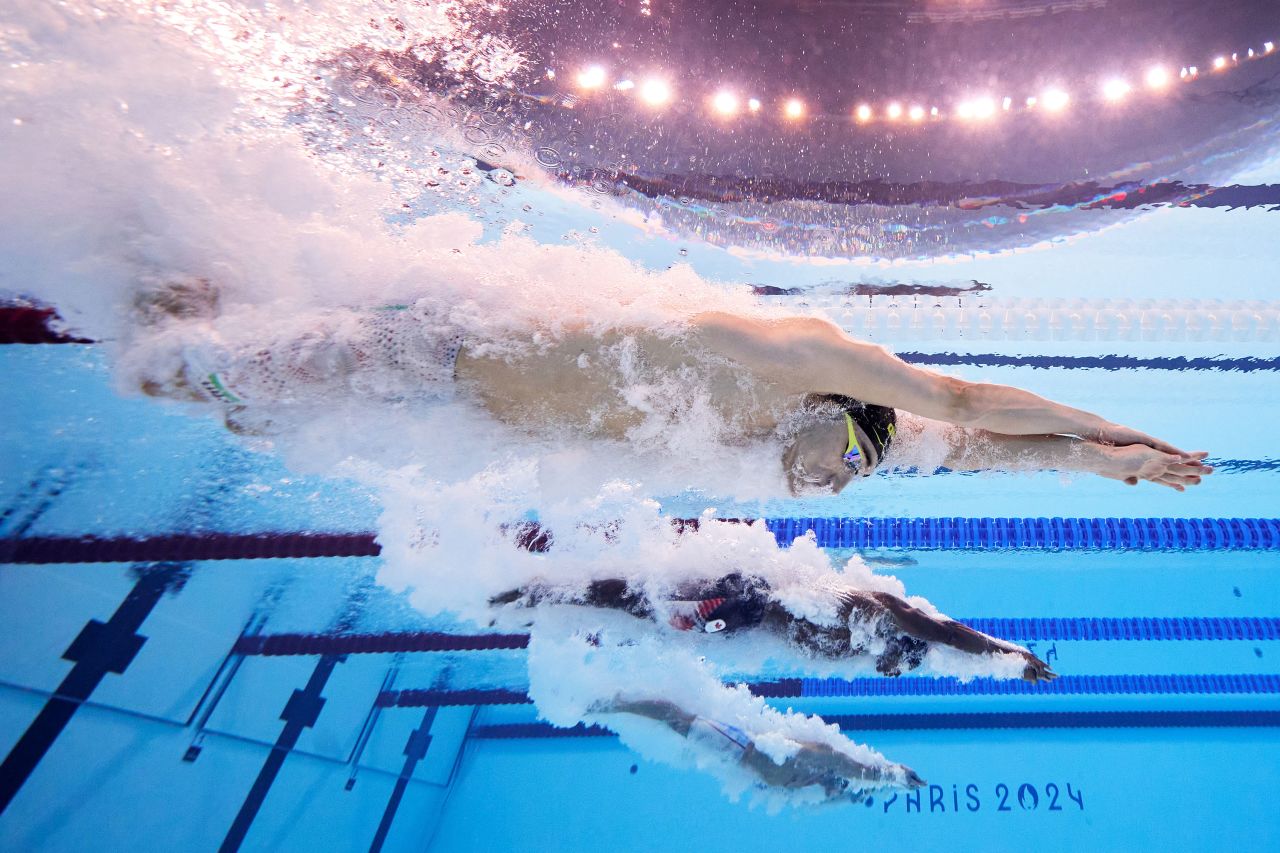 Hungary's Kristóf Milák, top, competes in the men's 100-meter butterfly final Saturday. 