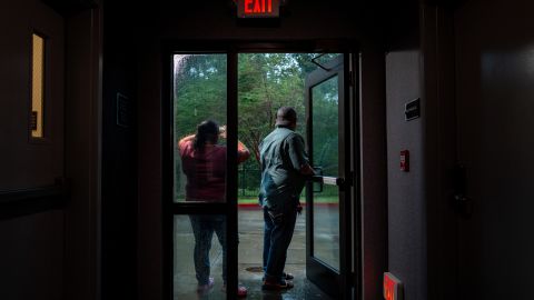 A family watches Hurricane Francine from their hotel in Houma, Louisiana, on September 11, 2024.