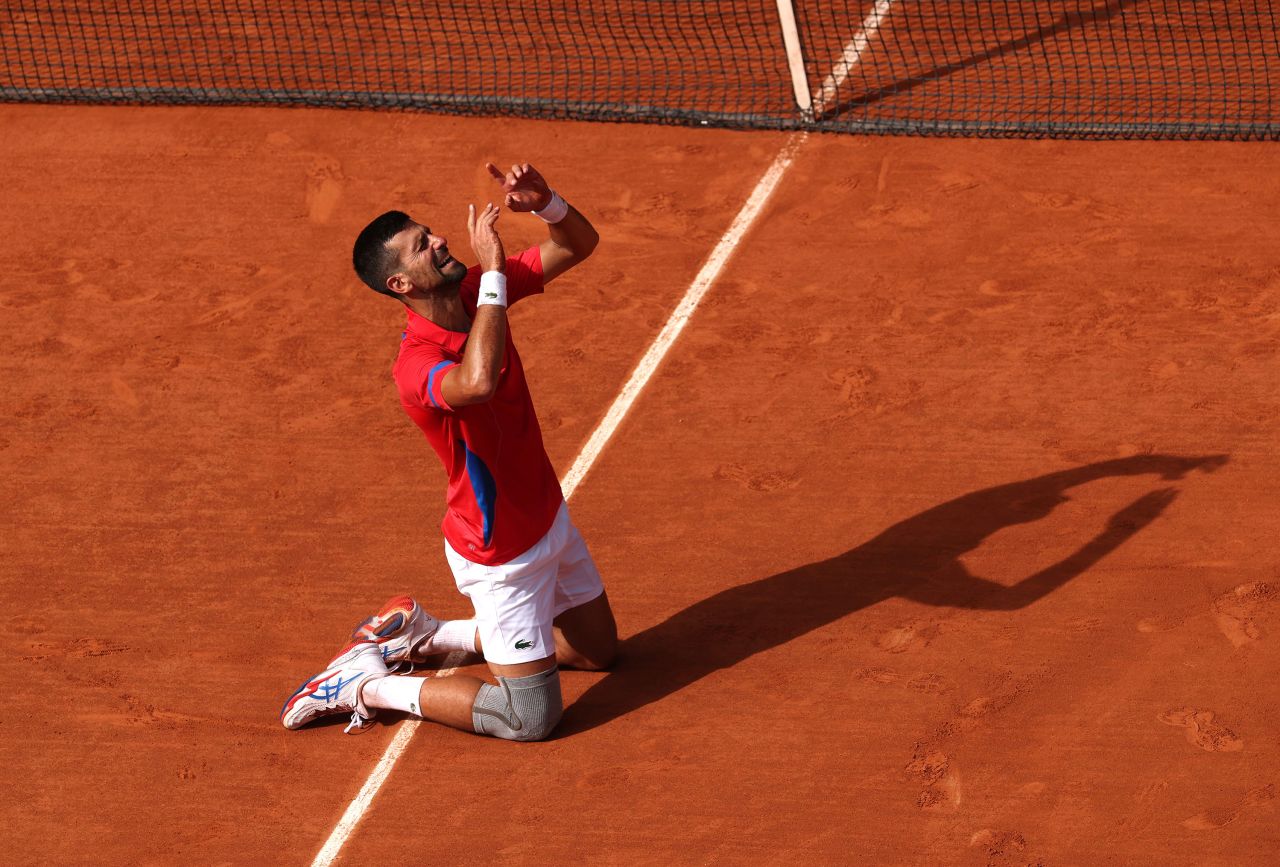 Serbia's Novak Djokovic celebrates match point against Carlos Alcaraz in the men's singles tennis final.