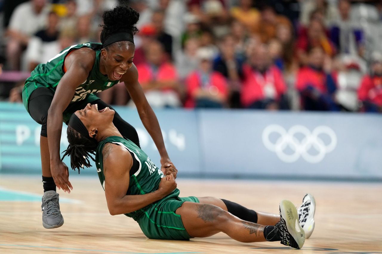 Nigeria’s Promise Amukamara, left, and Ezinne Kalu celebrate during the women’s basketball game against Canada on August 4. 