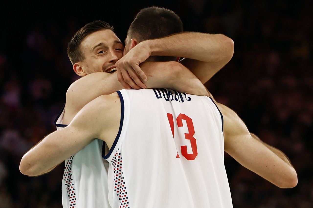 Aleksa Avramovic and Ognjen Dobric of Serbia celebrate their team's win over Australia on Tuesday.