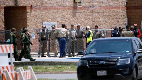 FILE—Law enforcement, and other first responders, gather outside Robb Elementary School following a shooting, May 24, 2022, in Uvalde, Texas. Weeks after the shooting, questions remain about how and why police armed with rifles and bulletproof shields waited so long after the 18-year-old gunman got into the school. (AP Photo/Dario Lopez-Mills, File)