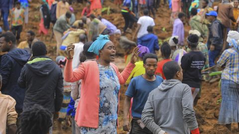 In this handout photo released by Gofa Zone Government Communication Affairs Department, a woman cries as hundreds of people gather at the site of a mudslide in the Kencho Shacha Gozdi district, Gofa Zone, southern Ethiopia, Monday, July 22, 2024. At least 146 people were killed in mudslides in a remote part of Ethiopia that has been hit with heavy rainfall, according to local authorities. (Isayas Churga/Gofa Zone Government Communication Affairs Department via AP)