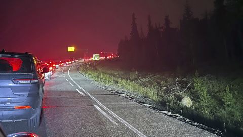 This photo provided by Carolyn Campbell shows cars clogging the highway as people evacuate because of wildfires early Tuesday, July 23, 2024, in Jasper, Alberta. Multiple wildfires in Canada’s Jasper National Park have flared up, forcing all park visitors along with the 4,700 residents of the Jasper townsite to flee. (Carolyn Campbell/The Canadian Press via AP)