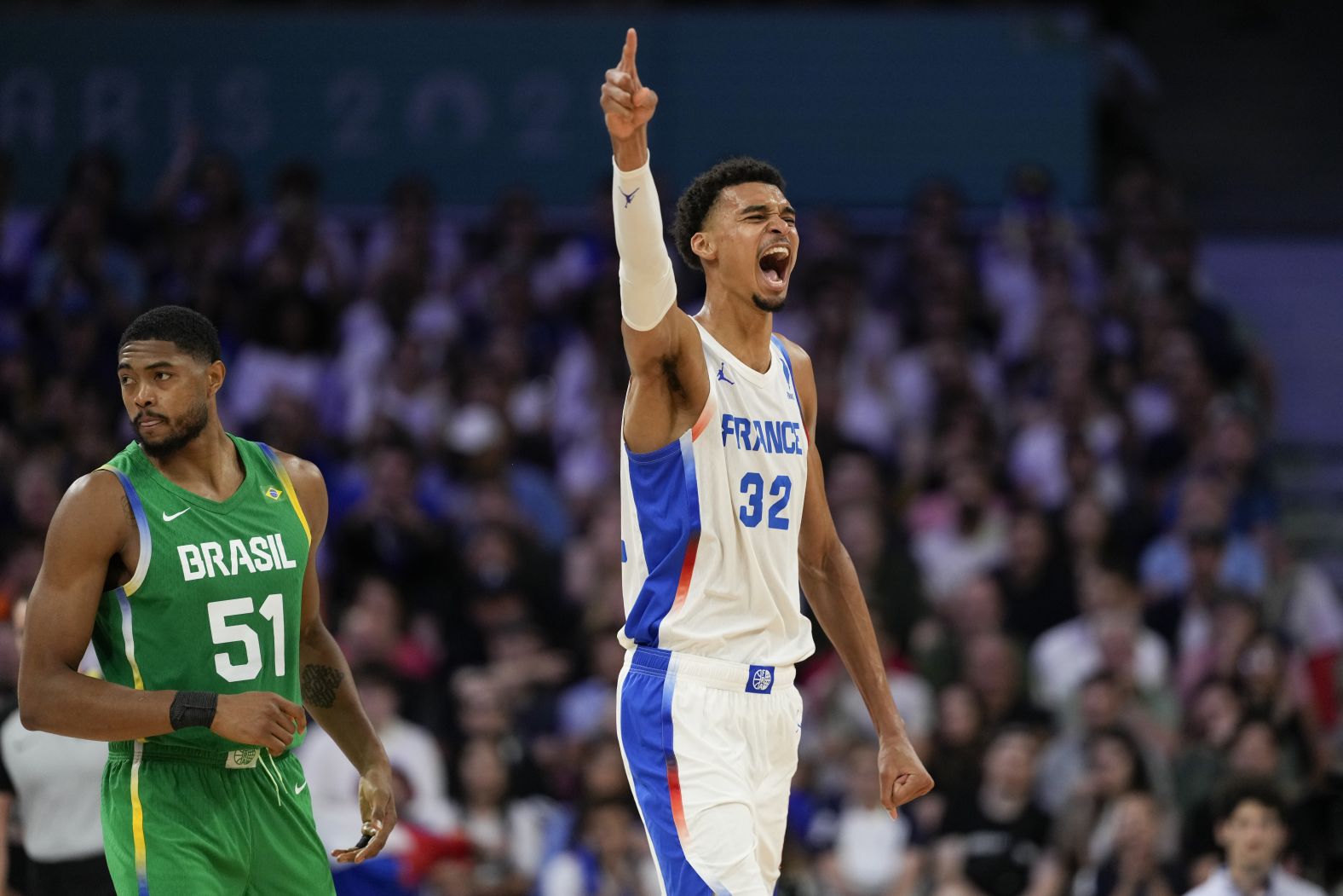 French basketball superstar Victor Wembanyama celebrates a Brazil turnover during the teams' opening game on July 27. Wembanyama had 19 points, nine rebounds, two assists, four steals and three blocks as <a href="https://www.cnn.com/sport/live-news/paris-olympics-news-2024-07-27#h_adc7279c0a5db023f742855ffd868995"