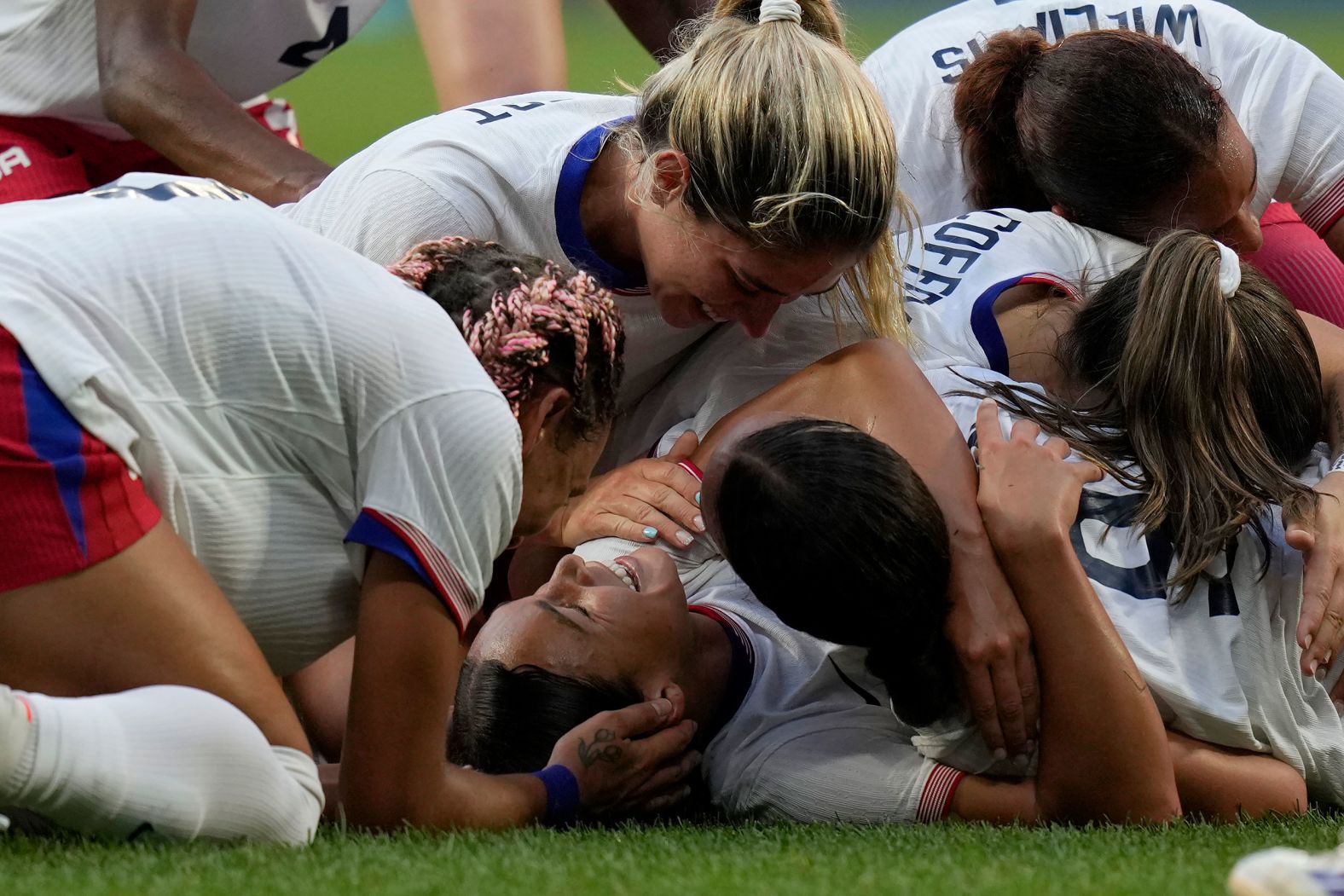 US soccer player Sophia Smith is mobbed by teammates after scoring an extra-time goal against Germany on Tuesday, August 6. The Americans won 1-0 <a href="https://www.cnn.com/sport/live-news/paris-olympics-news-2024-08-06#h_41eda3d47e1ac9b93c1db0e569023f12"