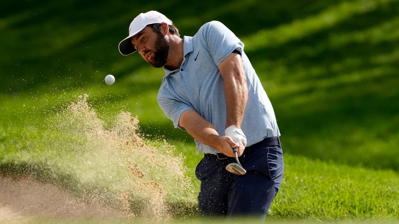 Scottie Scheffler hits from the bunker on the first hole during the first round of the BMW Championship golf event at Castle Pines Golf Club, on August 22, 2024, in Castle Rock, Colo.