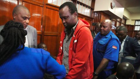 Kevin Adam Kinyanjui Kangethe is escorted out of a courtroom in Nairobi, Kenya, on February 14, 2024. He was just extradited to the US to face murder charges.