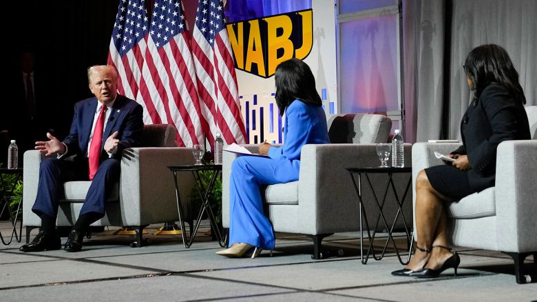 Republican presidential candidate former President Donald Trump, left, speaks at the National Association of Black Journalists convention, Wednesday, July 31, 2024, in Chicago. (AP Photo/Charles Rex Arbogast)