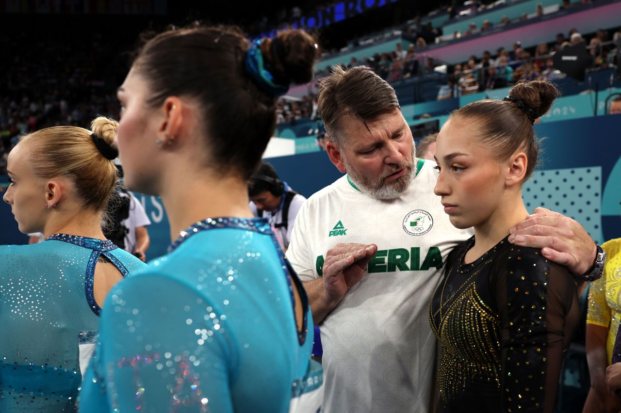 Kaylia Nemour of Algeria listens to her coach Marc Chirilcenco during the women's gymnastics all-around final on Thursday.