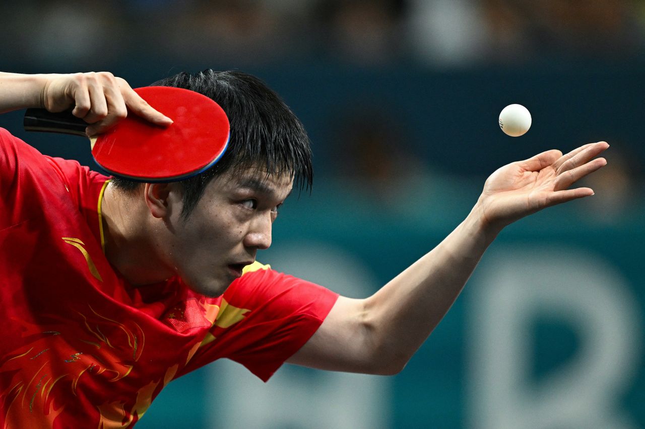 China's Fan Zhendong serves during the men’s singles table tennis final on August 4. 