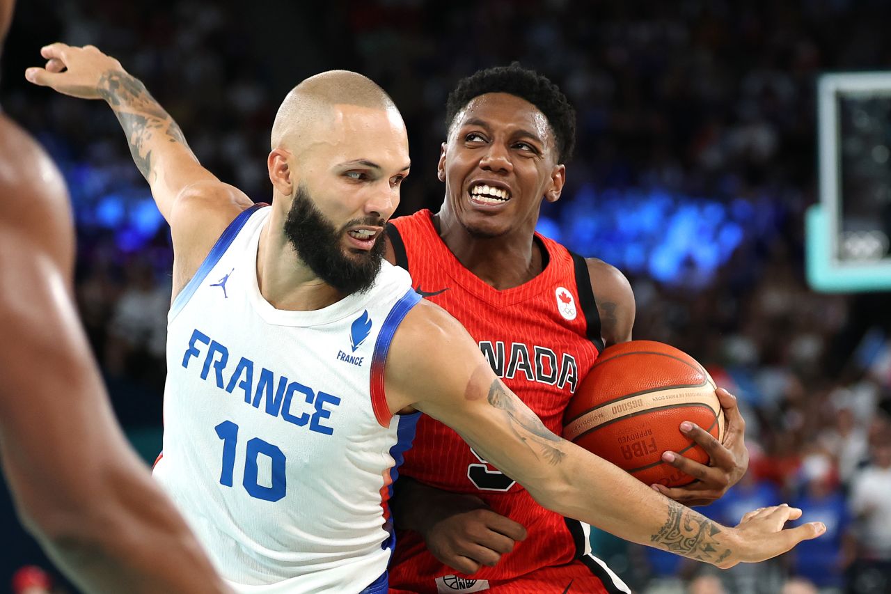 RJ Barrett of Canada, right, drives past Evan Fournier of France on Tuesday.