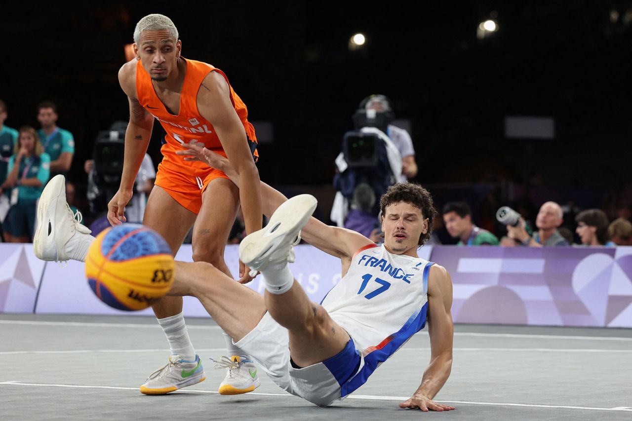 Netherlands' Worthy de Jong knocks over France's Jules Rambaut during the men's 3x3 basketball gold medal game.