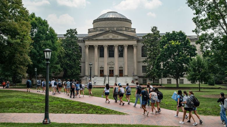 People walk on the campus of the University of North Carolina Chapel Hill on June 29, 2023