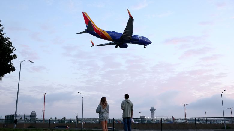 People view a Southwest Airlines plane landing from a park next to Los Angeles International Airport (LAX) on August 31, 2023 in Los Angeles, California.