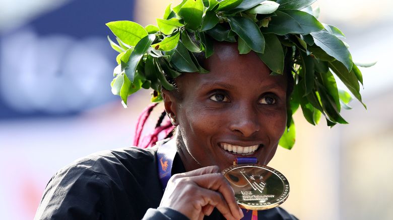 NEW YORK, NEW YORK - NOVEMBER 05: Hellen Obiri of Kenya celebrates her gold medal win in the Women's Divison during the 2023 TCS New York City Marathon on November 05, 2023 in Central Park in New York City. (Photo by Elsa/Getty Images)