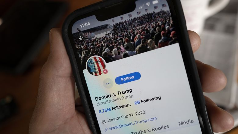 In this photo illustration, Republican presidential candidate former President Donald Trump's social media platform Truth Social is shown on a cell phone.