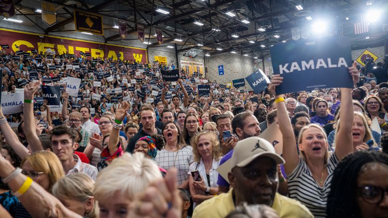 WEST ALLIS, WI - JULY 23: Attendees of Vice President Kamala Harris' campaign event wave signs and cheer on July 23rd, 2024 at West Allis Central High School. (Photo by Sara Stathas for the Washington Post)