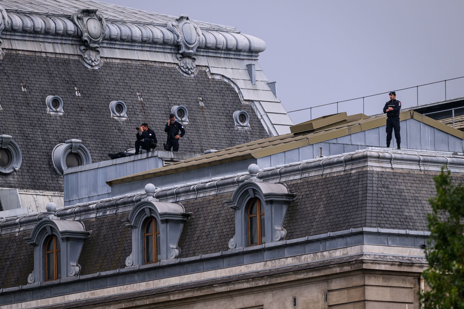 Law enforcement officers keep watch in Paris.