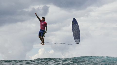 TOPSHOT - Brazil's Gabriel Medina reacts after getting a large wave in the 5th heat of the men's surfing round 3, during the Paris 2024 Olympic Games, in Teahupo'o, on the French Polynesian Island of Tahiti, on July 29, 2024. (Photo by Jerome BROUILLET / AFP) (Photo by JEROME BROUILLET/AFP via Getty Images)