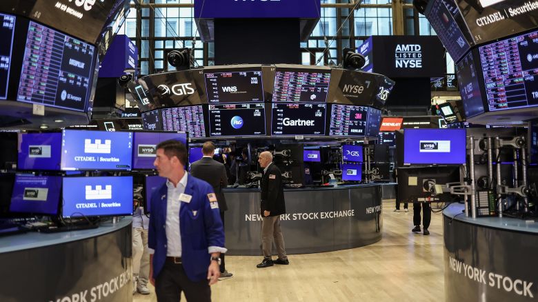 Traders work on the floor of the New York Stock Exchange (NYSE) ahead of the closing bell in New York City on August 5, 2024.