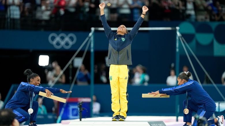 Silver medalist Simone Biles of United States and bronze medalist Jordan Chiles of the United States celebrate gold medalist Rebeca Andrade of Brazil during the medal ceremony after the Women's Floor Exercise Final on day ten of the Olympic Games Paris 2024 at Bercy Arena on August 5, 2024 in Paris, France.