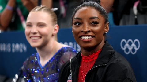 PARIS, FRANCE - AUGUST 03: Simone Biles of Team United States looks on as she sits next to teammate Jade Carey during the Artistic Gymnastics Women's Vault Final on day eight of the Olympic Games Paris 2024 at Bercy Arena on August 03, 2024 in Paris, France. (Photo by Naomi Baker/Getty Images)