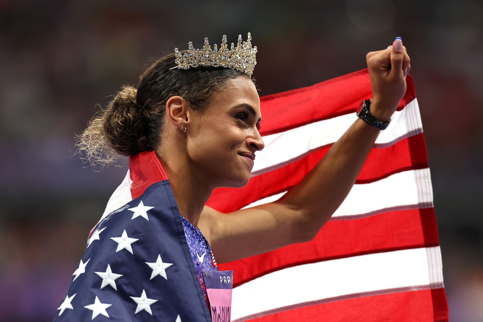 US athlete Sydney McLaughlin-Levrone wears a crown after <a href="https://www.cnn.com/sport/live-news/paris-olympics-news-2024-08-08#h_7a468b4b00d98096456b06d1f376ab1a"