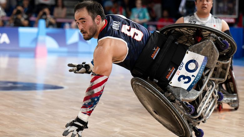 TOPSHOT - US' Chuck Aoki passes the ball as he competes in the final match of the Open Wheelchair Rugby during the Paris 2024 Paralympics at the Champ de Mars Arena, in Paris on September 2, 2024. (Photo by Ian RICE / AFP) (Photo by IAN RICE/AFP via Getty Images)