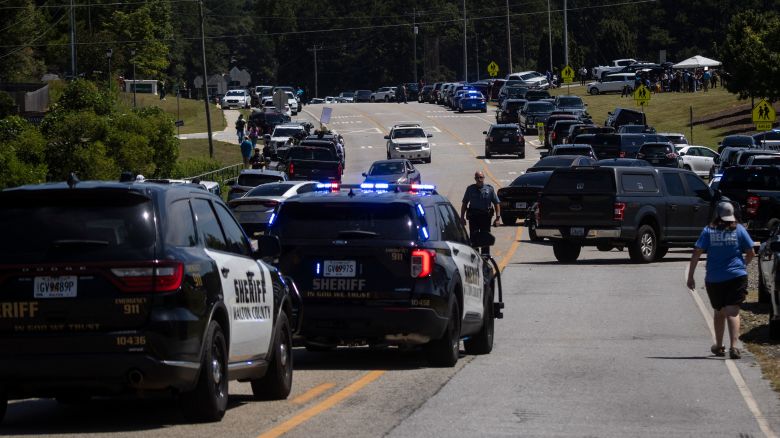 Law enforcement and first responders control traffic after a shooting took place at Apalachee High School in Winder, Georgia, on September 4, 2024. Police took a suspect into custody after the shooting on Wednesday, with students evacuated from the scene and local media reporting fatalities. CNN, citing unnamed law enforcement sources, reported that four people had been killed and 30 wounded. Other outlets reported two deaths. (Photo by CHRISTIAN MONTERROSA / AFP) (Photo by CHRISTIAN MONTERROSA/AFP via Getty Images)