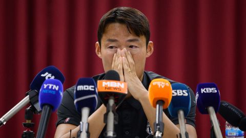 South Korean footballer Son Jun-ho wipes his eyes during a press conference at his K League club Suwon FC in Suwon on September 11, 2024.