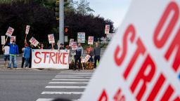 Workers with picket signs outside the Boeing Co. manufacturing facility during a strike in Everett, Washington, US, on Friday, Sept. 13, 2024. Boeing Co. factory workers walked off the job for the first time in 16 years, halting manufacturing across the planemaker's Seattle hub after members of its largest union voted overwhelmingly to reject a contract offer and go on strike.