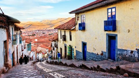 Historic architecture of Cusco along steep street northwest of Plaza de Armas, Peru