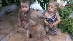 Three children, aged 3, 5 and 6, sit on the roof of a mosque in Baghlan province, after being rescued from flooding and mud torrents that have affected 18 districts across at least three provinces in northern Afghanistan, according to the United Nations’ World Food Programme.