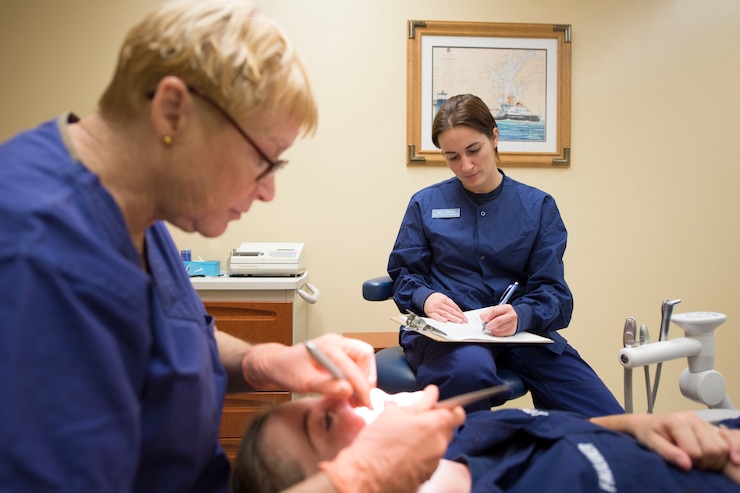 Coast Guard Petty Officer 3rd Class Lindsey Peters conducts duties as a health services technician at the Coast Guard Baltimore Clinic in Baltimore, Md., Nov. 8, 2013.