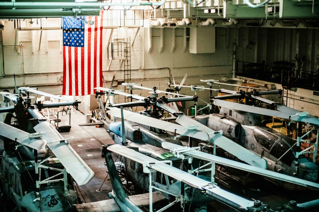 UH-1Y Venoms and AH-1Z Vipers attached to Marine Medium Tiltrotor Squadron (VMM) 165 (Reinforced), 15th Marine Expeditionary Unit, are staged in the hangar bay of the expeditionary sea base USS Miguel Keith (ESB 5) in the Philippine Sea Sept. 23, 2024. Elements of the 15th MEU are embarked aboard Miguel Keith conducting routine operations in the U.S. 7th Fleet area of operations. 7th Fleet is the U.S. Navy’s largest forward-deployed numbered fleet, and routinely interacts and operates with allies and partners in preserving a free and open Indo-Pacific. (U.S. Marine Corps photo by Cpl. Luis Agostini)