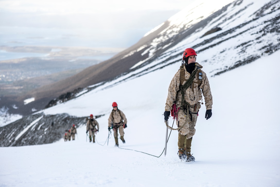 Marine Corps Mountain Warfare Training Center instructors hike as 3-man glacier teams alongside Argentine marines to the summit of a mountain range in Argentina, Sept. 6, 2024. Knowledge exchanges such as these foster camaraderie and mutual reliance between U.S. and Argentine forces which aims to strengthen their ability to cooperate for future exercises.