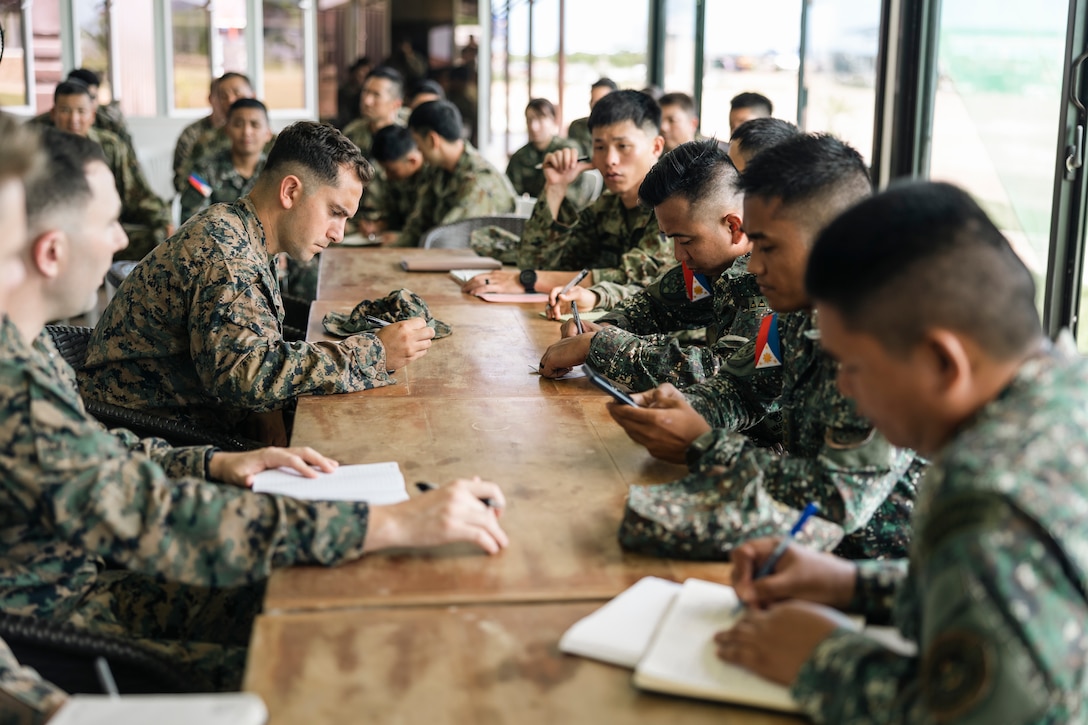 Marines with Marine Rotational Force-Southeast Asia, Philippine Marines with 4th Marine Brigade, and service members of the Japan Ground Self-Defense Force hold a planning meeting during KAMANDAG 8 in Philippines, Oct. 15, 2024. KAMANDAG is an annual Philippine and U.S. Marine Corps-led exercise aimed at enhancing the Armed Forces of the Philippines’ defense and humanitarian capabilities by providing training in combined operations with foreign militaries to keep a Free and Open Indo-Pacific.