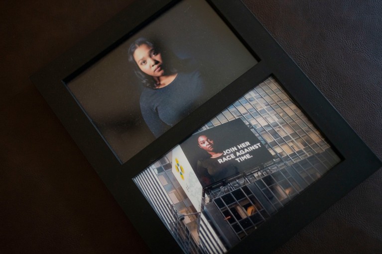 A photograph of a picture frame containing images of Genesis Jones and the billboard campaign she was part of