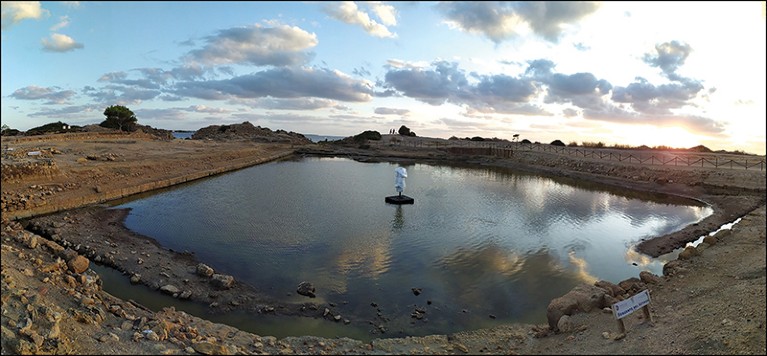 View of the refurbished ‘Kothon’ with a replica of the statue of Ba’al at its centre, a sacred pool of water in the countryside.