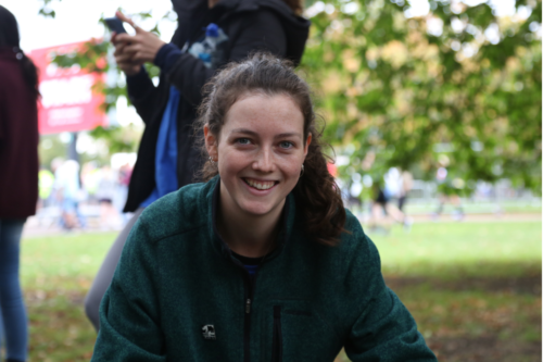 Woman crouching and smiling