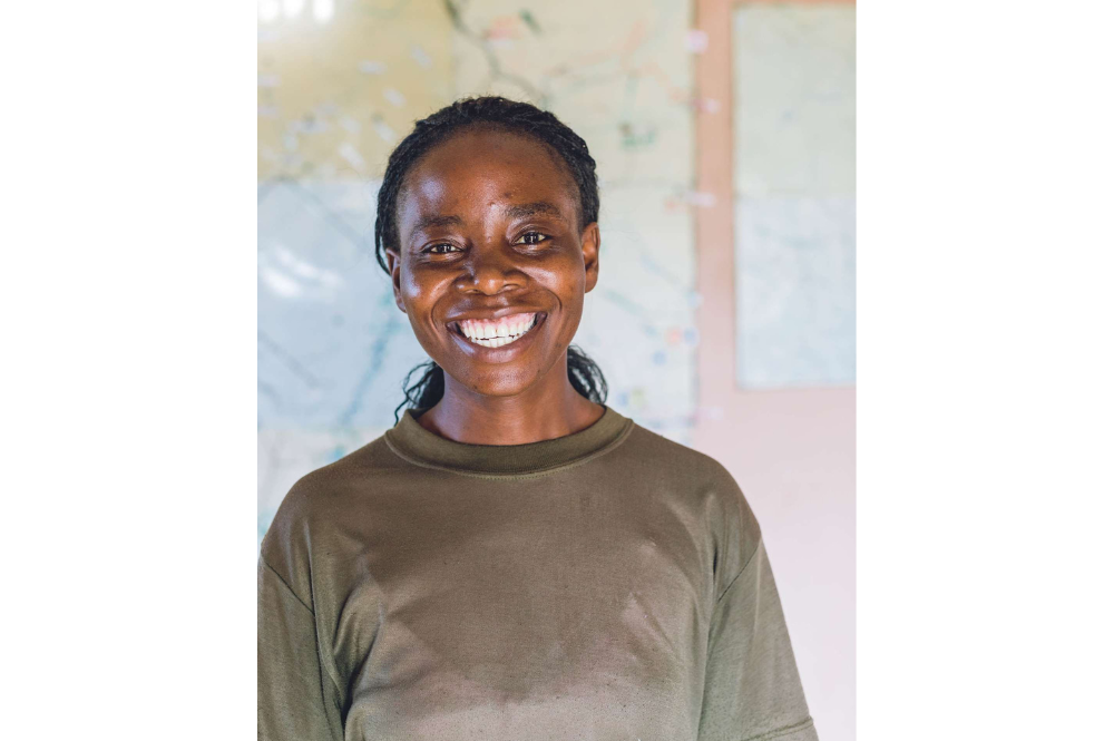 A woman smiling to the camera.